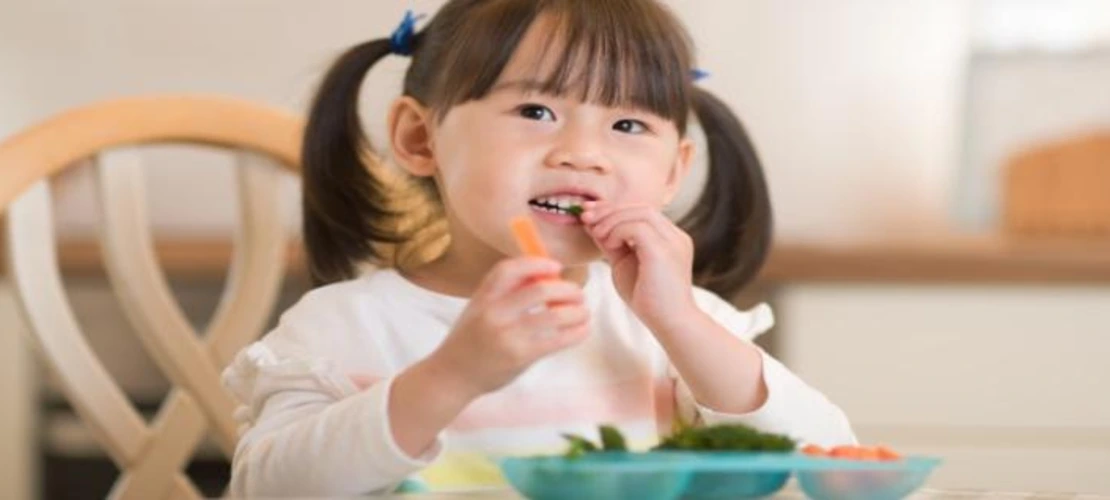 Child eating vegetables