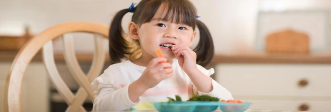 Child eating vegetables